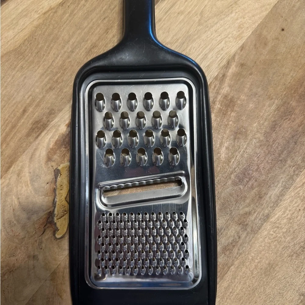 Sleek Black and Silver Handheld Grater